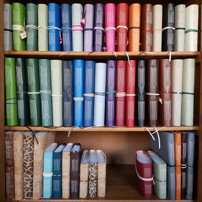 a row of coloured note books